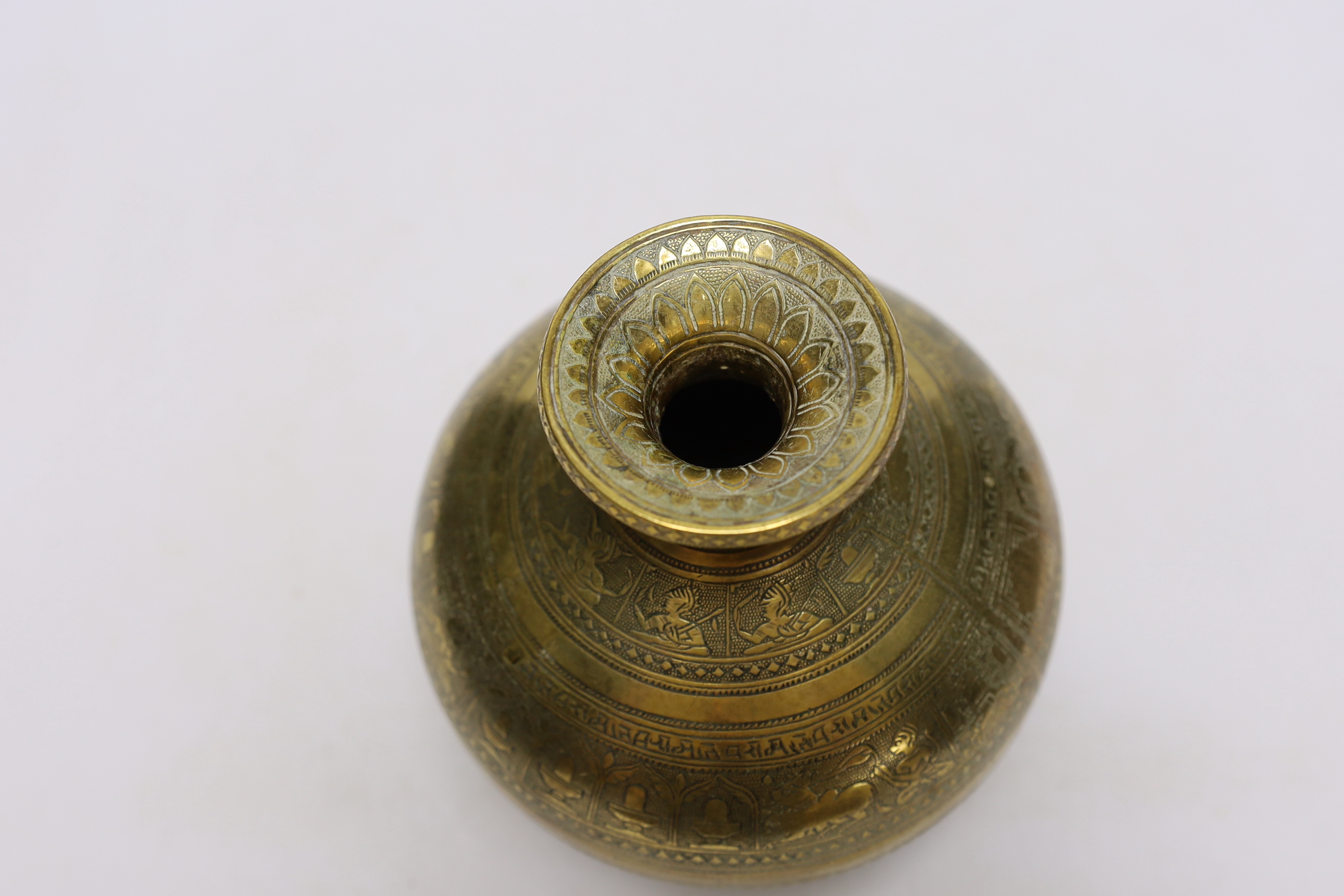 Eastern brassware to include a betel box on wheels, a vase with engraved detail and a pierced box, tallest 15.5cm (3)